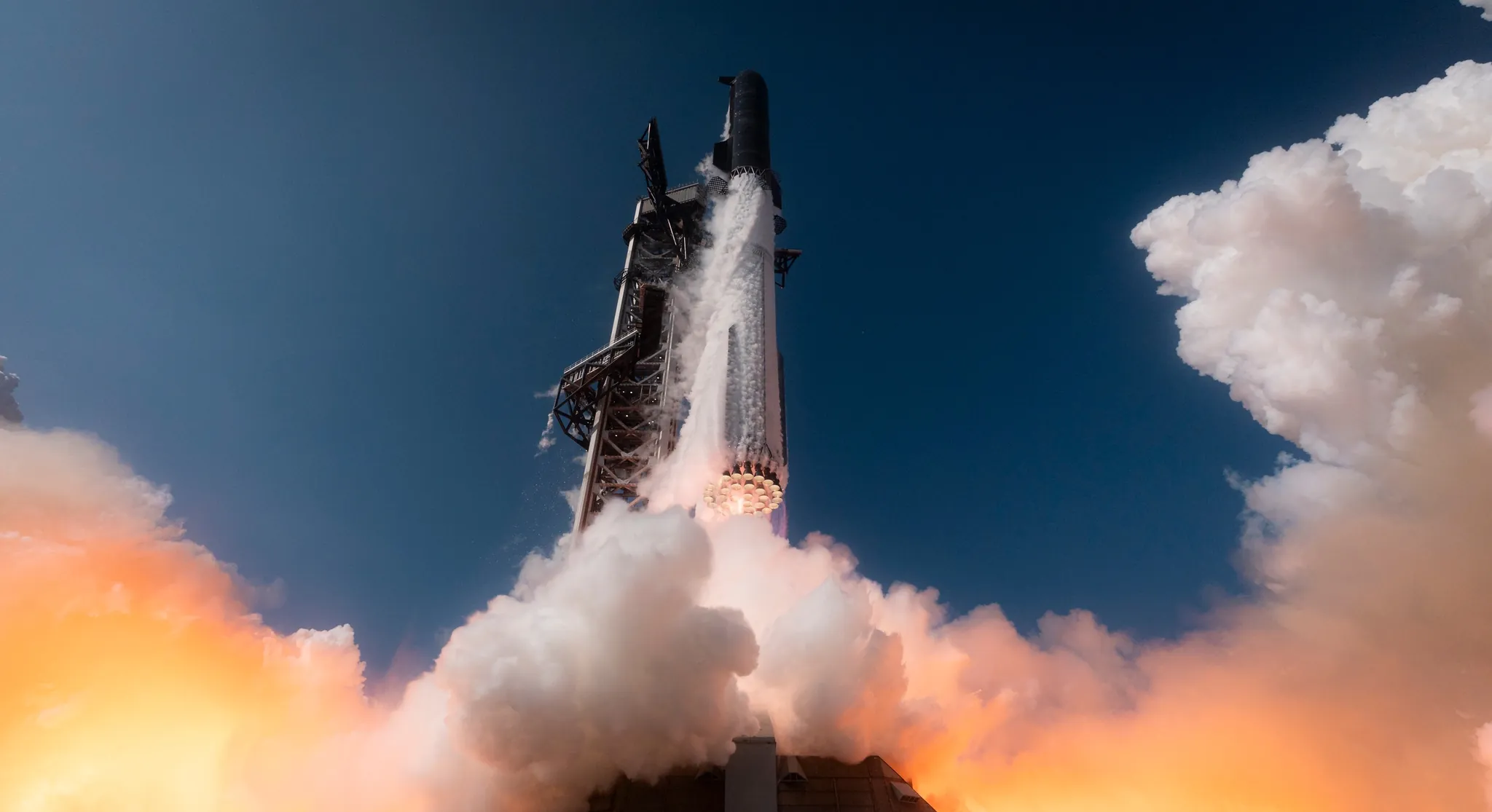 SpaceX Starship lifting off during Flight 12 from Texas at dusk