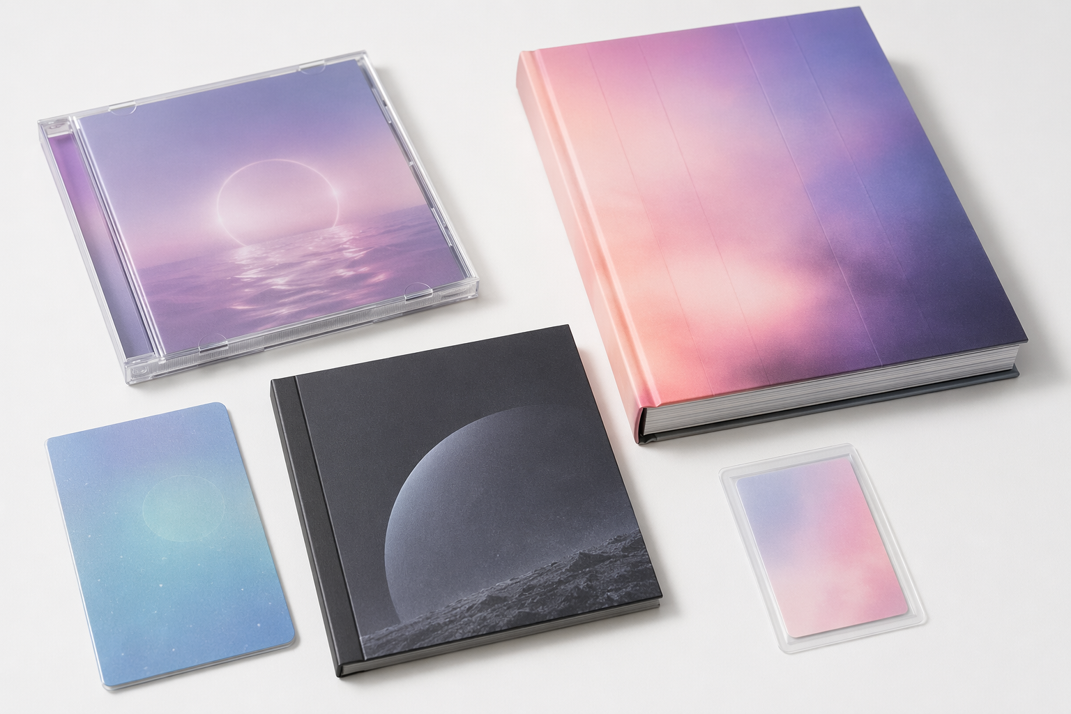 Different K-pop album packaging formats arranged on a white surface