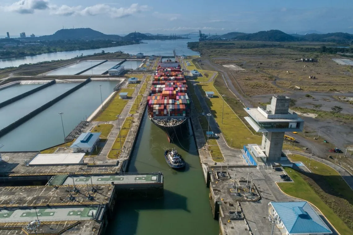 Aerial view of the Panama Canal Neopanamax locks with a large container ship transiting through the lock chambers